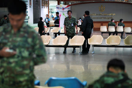 Thai military personnel and forensic experts stand near a site of bomb blast inside the Phramongkutklao Hospital, in Bangkok, Thailand, May 22, 2017. REUTERS/Athit Perawongmetha