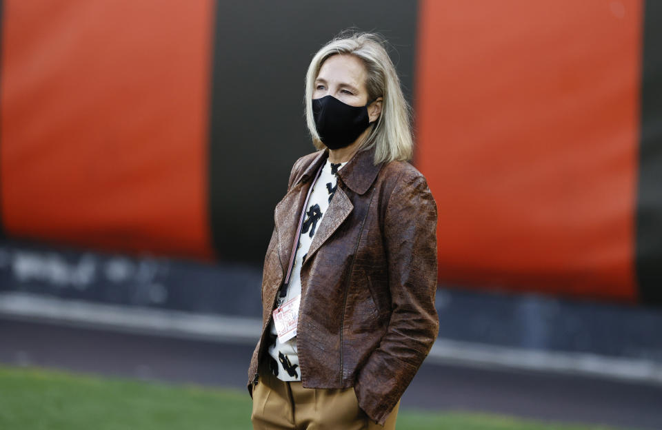 FILE - In this Sept. 17, 2020, file photo, Cleveland Browns co-owner Dee Haslam walks the field before the team's NFL football game against the Cincinnati Bengals in Cleveland. “We’re seeing more and more women that love the sport and who want a career in sports," Haslam said last month. "The door has swung wide open and I am so excited. I look forward to the moment when we don’t have to talk about how we get the door open for women and people of color, that the door is wide open.” (AP Photo/Ron Schwane, File)