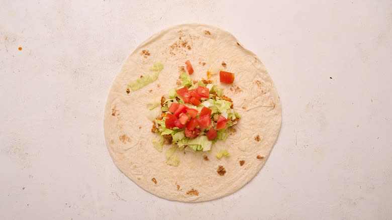 lettuce and tomato in crunchwrap