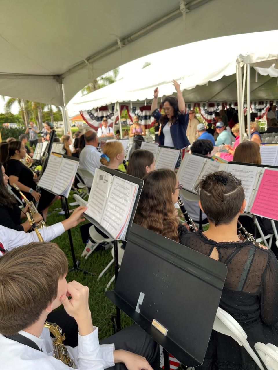 Maestro Kelly Parker leads Pine Ridge Middle School  band members at the annual Earl Hodges Memorial Day picnic and celebration in  Naples on Monday, May 29, 2023.