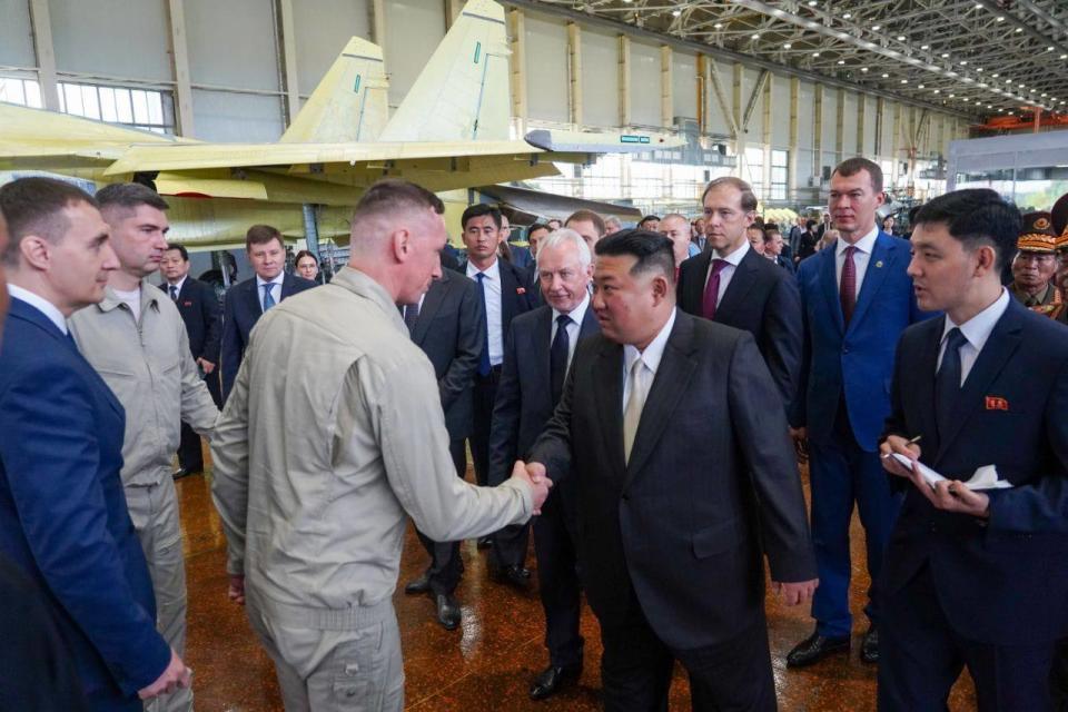 North Korean leader Kim Jong Un visits the KnAAPO aircraft factory, accompanied by Russian Deputy Prime Minister and Minister of Industry and Trade, <span class="caas-xray-inline-tooltip"><span class="caas-xray-inline caas-xray-entity caas-xray-pill rapid-nonanchor-lt" data-entity-id="Denis_Manturov" data-ylk="cid:Denis_Manturov;pos:2;elmt:wiki;sec:pill-inline-entity;elm:pill-inline-text;itc:1;cat:OfficeHolder;" tabindex="0" aria-haspopup="dialog"><a href="https://search.yahoo.com/search?p=Denis%20Manturov" data-i13n="cid:Denis_Manturov;pos:2;elmt:wiki;sec:pill-inline-entity;elm:pill-inline-text;itc:1;cat:OfficeHolder;" tabindex="-1" data-ylk="slk:Denis Manturov;cid:Denis_Manturov;pos:2;elmt:wiki;sec:pill-inline-entity;elm:pill-inline-text;itc:1;cat:OfficeHolder;" class="link ">Denis Manturov</a></span></span> (third from right), on September 15, 2023. <em>Photo by Gov of Khabarovsk Reg/M. Degtyaryov/Anadolu Agency via Getty Images</em>
