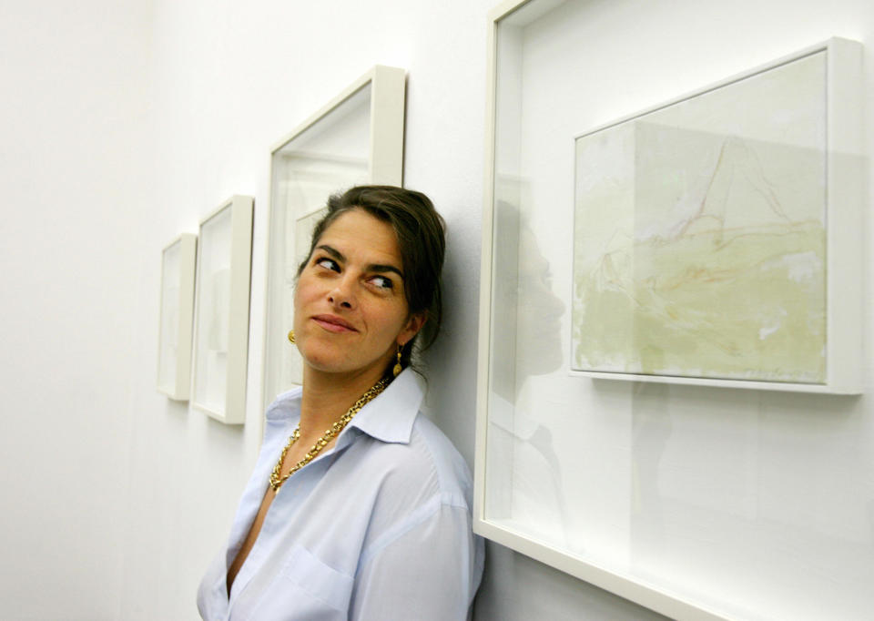 British artist Tracey Emin poses next to