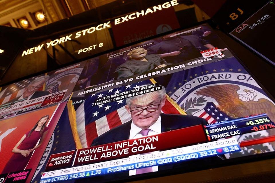  Federal Reserve Board Chairman Jerome Powell appears on a screen on the trading floor of the New York Stock Exchange during the news conference following February’s rate decision. Today’s decision might be a tougher choice.