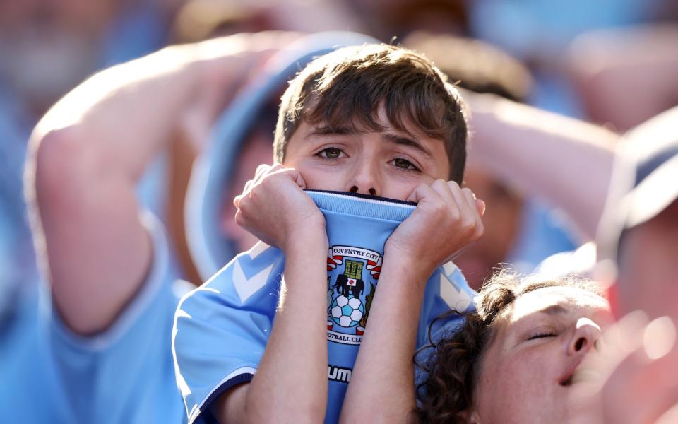A young Luton Town fan reacts during the Sky Bet Championship Play-Off Final - Getty Images/Alex Pantling