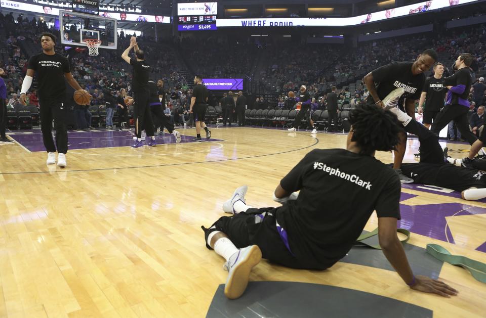 Kings and Celtics players wore shirts honoring Stephon Clark on Sunday. (AP Photo/Steve Yeater)