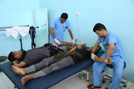 Pro-government soldiers are helped with rehabilitation exercises at a physiotherapy center in the northern city of Marib, Yemen November 4, 2017. REUTERS/Ali Owidha