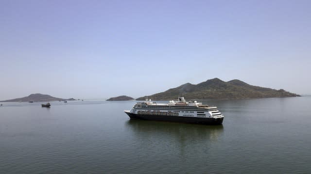 The Zaandam cruise ship is anchored shortly after it arrived at the bay of Panama City