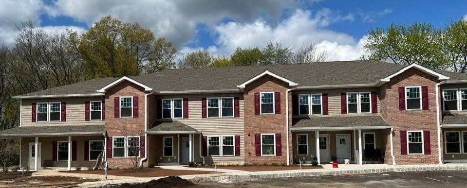 Thirteen of 25 residential units were opened on a former industrial site in- Randolph, representing the first phase of the largest-ever project undertaken by the Morris Habitat for Humanity.