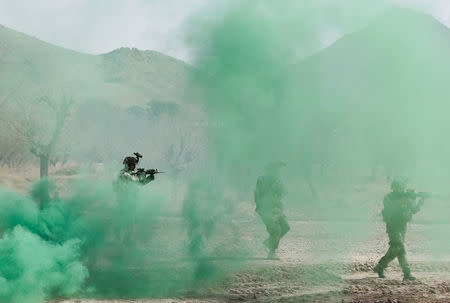 Afghan army Special Forces take part in a military exercise in Rishkhur district outside Kabul, Afghanistan March 12, 2017. Picture taken on March 12, 2017. REUTERS/Omar Sobhani