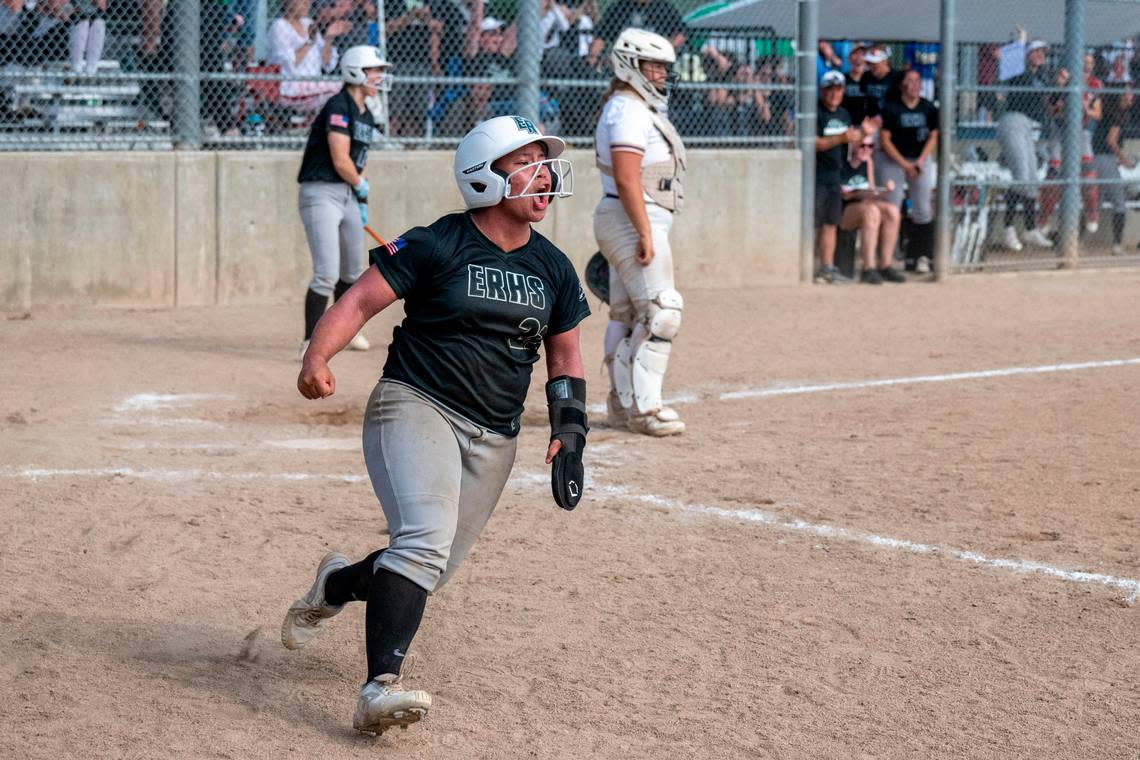 Puyallup Emerald Ridge’s Isabel Quintanilla celebrates after a 2-run single by Lillian Stariha tied the game at 5-5 in the bottom of the seventh inning of the 4A West Central/Southwest district softball championship game at Kent Service Fields on Saturday, May 20, 2023, in Kent, Wash.