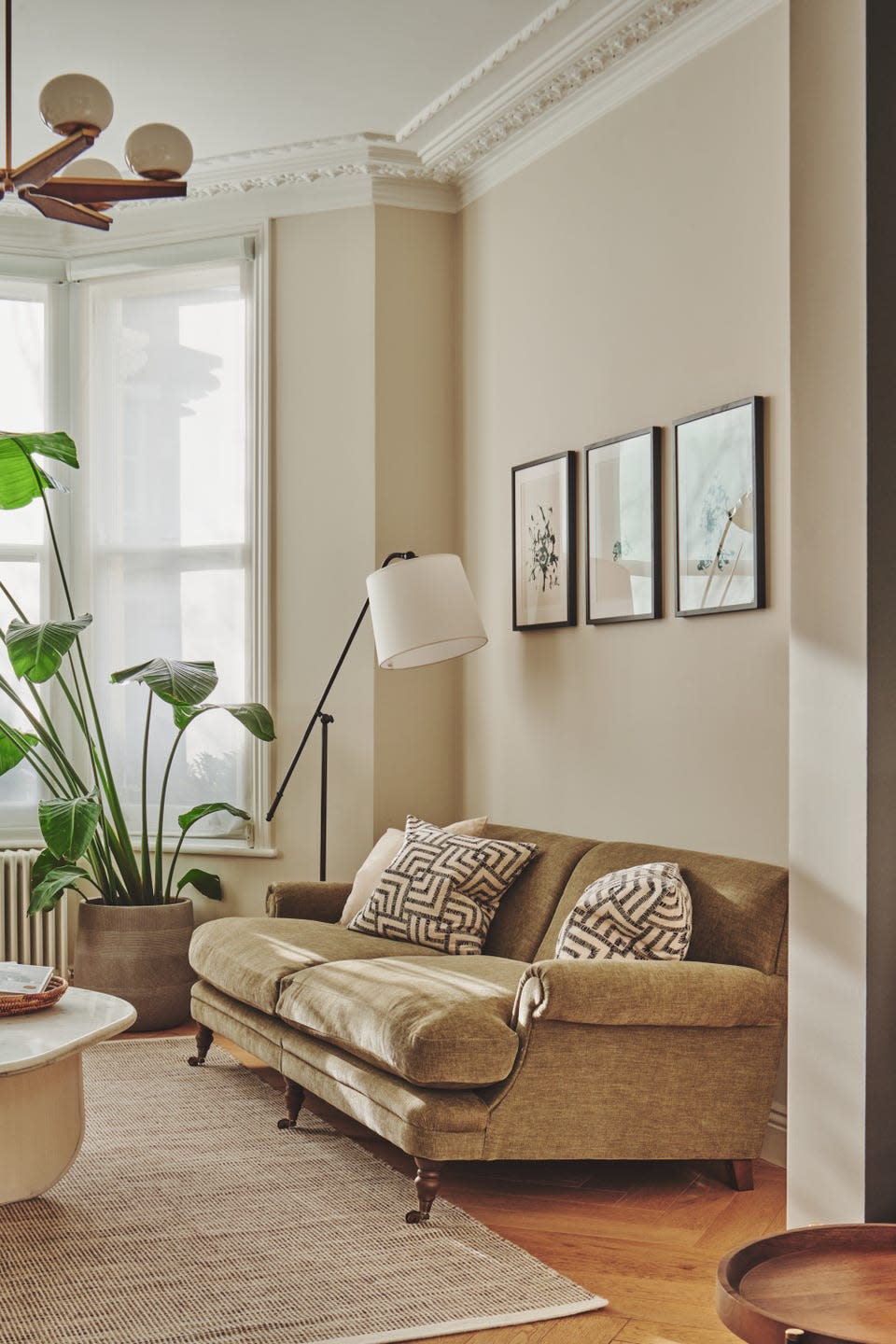 living room with sofa and floor lamp