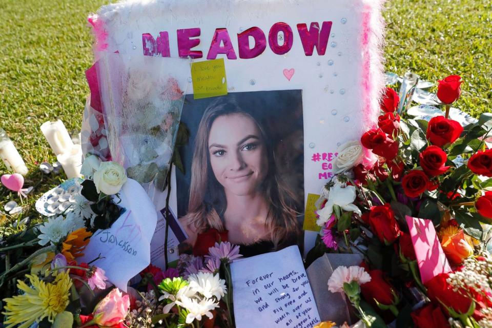 PHOTO: A photo of Meadow Pollack, one of the seventeen victims who was killed in the shooting at Marjory Stoneman Douglas High School, sits against a cross as part of a public memorial, in Parkland, Fla., Feb. 17, 2018. (Gerald Herbert/AP)