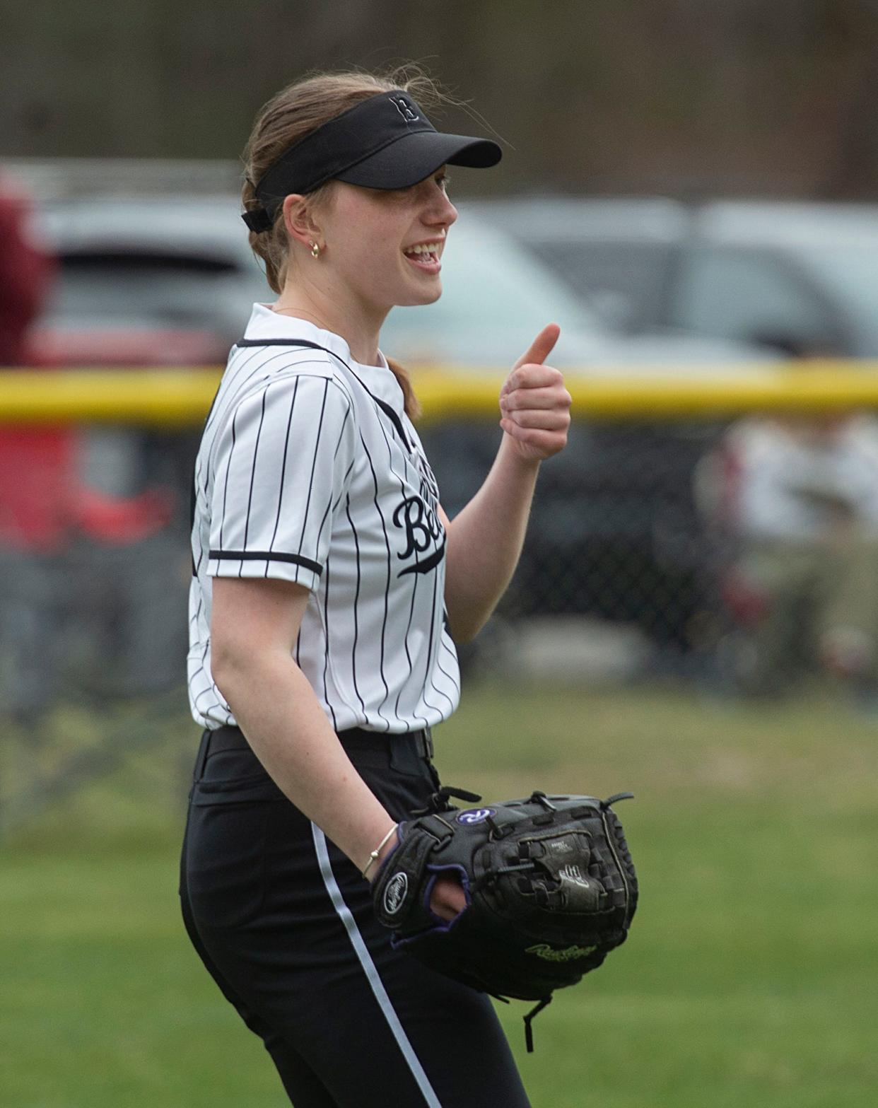 Bellingham High School's Julia Simon smiles with a thumbs up after making a catch in left field against Millis, April 10, 2024.