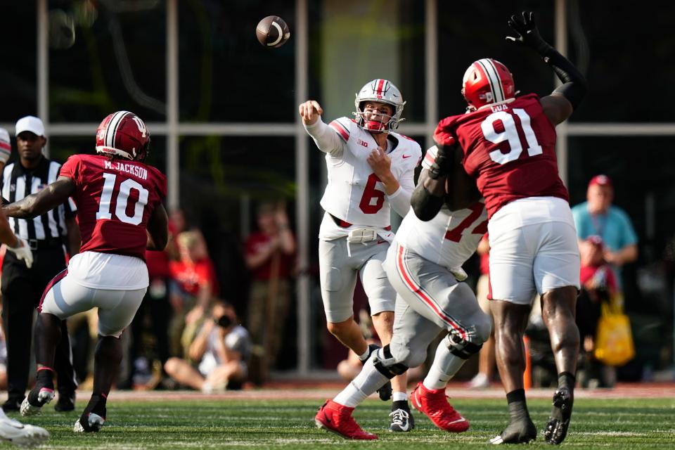 Sep 2, 2023; Bloomington, Indiana, USA; Ohio State Buckeyes quarterback Kyle McCord (6) throws a pass over Indiana Hoosiers defensive lineman LeDarrius Cox (91) during the second half of the NCAA football game at Indiana University Memorial Stadium. Ohio State won 23-3.