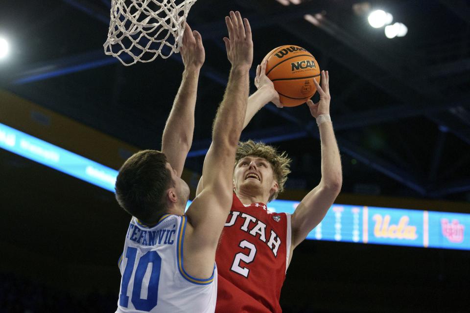 Utah guard Cole Bajema (2) goes to the basket against UCLA guard Lazar Stefanovic (10) during the first half of an NCAA college basketball game, Sunday, Feb. 18, 2024, in Los Angeles. | Eric Thayer, AP