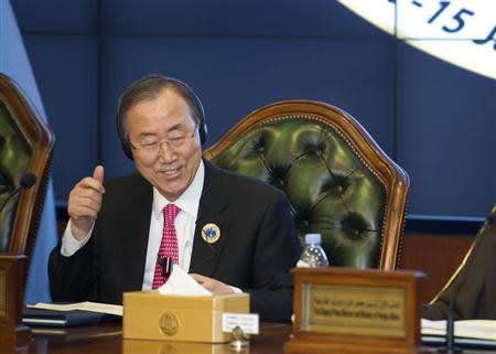 United Nations Secretary-General Ban Ki-Moon gives a thumbs up sign at the end of the Second International Humanitarian Pledging Conference for Syria held at Bayan Palace in Kuwait, January 15, 2014. REUTERS/Stephanie McGehee