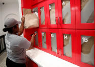 An employee retrieves a cereal order at the Kellogg's NYC cafe in Midtown Manhattan in New York City, U.S., June 29, 2016. REUTERS/Brendan McDermid