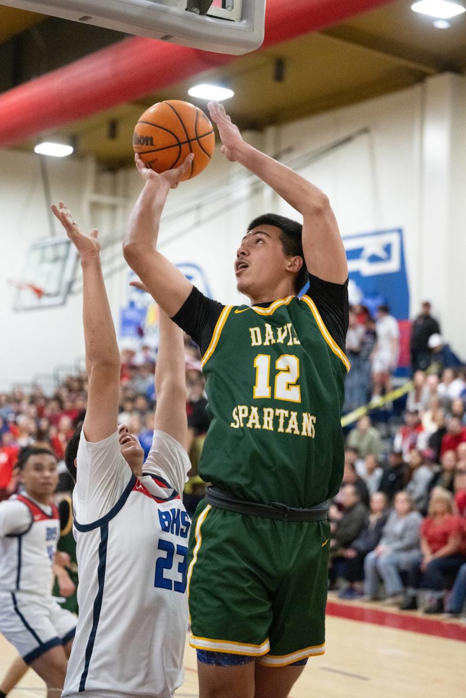 Davis’ John Motta shoots during the Western Athletic Conference game with Beyer at Beyer High School in Modesto, Calif., Friday, Feb. 2, 2024.