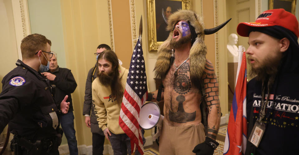 WASHINGTON, DC - JANUARY 06: Protesters interact with Capitol Police inside the U.S. Capitol Building on January 06, 2021 in Washington, DC. Congress held a joint session today to ratify President-elect Joe Biden's 306-232 Electoral College win over President Donald Trump. A group of Republican senators said they would reject the Electoral College votes of several states unless Congress appointed a commission to audit the election results. (Photo by Win McNamee/Getty Images)