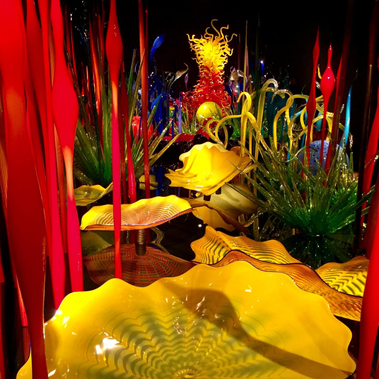 The greens, reds, purples and fiery yellow garden art of Chihuly Garden and Glass