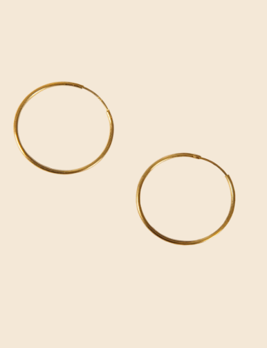 My gold hoop obsession isn't going anywhere fast. I've got every chunky style under the sun, but this more subtle pair from Birdsong is next on my wish list.<br><br><strong>Birdsong</strong> Medium Gold Hoops, $, available at <a href="https://birdsong.london/products/medium-gold-hoops" rel="nofollow noopener" target="_blank" data-ylk="slk:Birdsong" class="link rapid-noclick-resp">Birdsong</a>