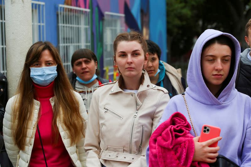 FILE PHOTO: Ukrainians who fled to Mexico amid Russia's invasion of their homeland, arrive at a shelter to wait to enter into the United States near the border between Mexico and U.S., in Tijuana