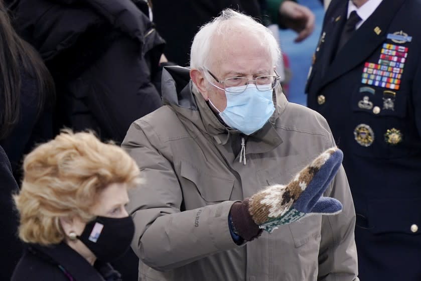 Sen. Bernie Sanders waving in mittens