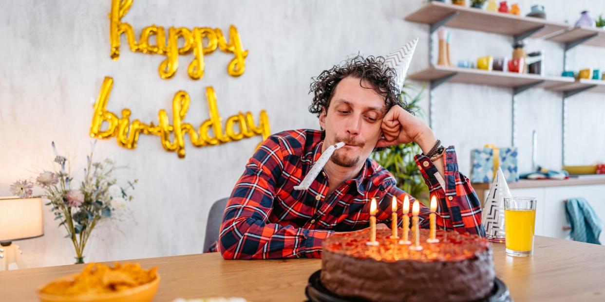 young man celebrating his birthday alone