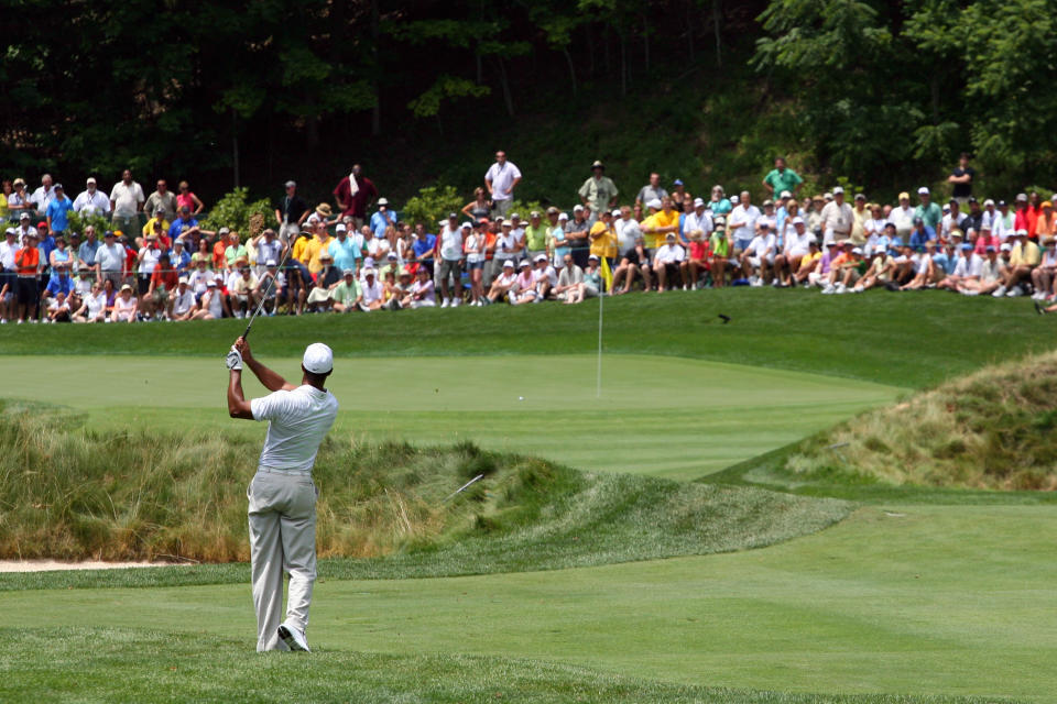 Tiger Woods hits his second shot on the ninth hole during the first round of the Greenbrier Classic at the Old White TPC on July 5, 2012 in White Sulphur Springs, West Virginia. (Photo by Hunter Martin/Getty Images)