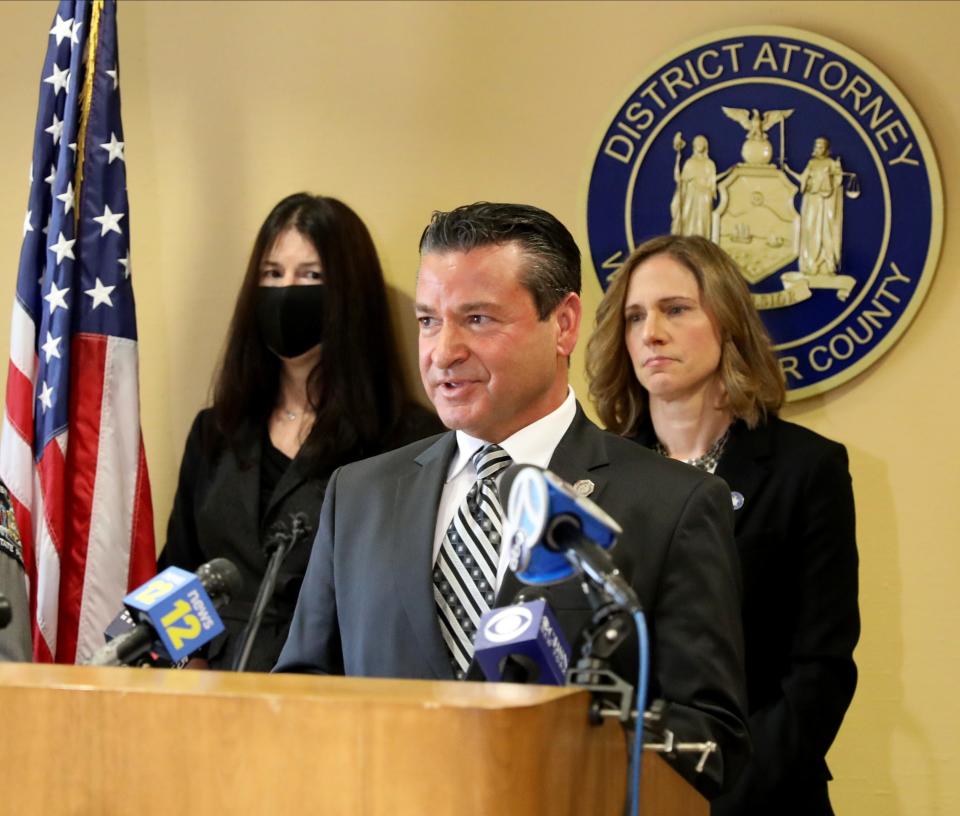 Retired New York State Police Investigator Joseph Becerra delivers remarks concerning the Robert Durst investigation, as Westchester County District Attorney Mimi Rocah is pictured at right, in her office in White Plains, Jan. 19, 2022. 