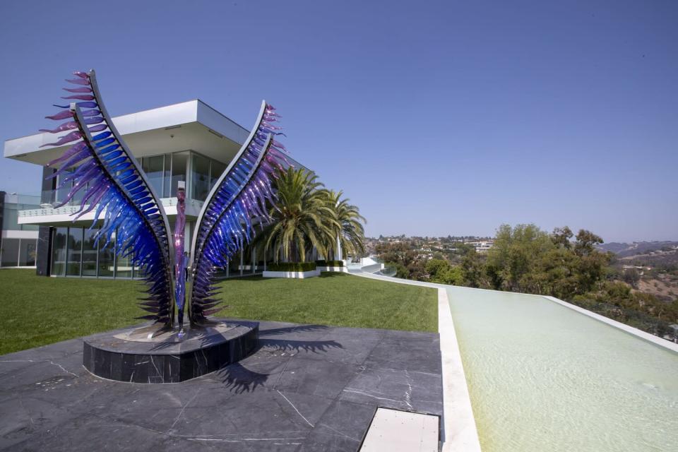 A view of a sculpture outside the home.