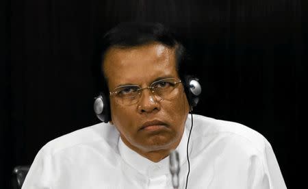 Sri Lanka's President Maithripala Sirisena listens to a speech during a Parliament session marking the 70th anniversary of Sri Lanka's Government, in Colombo, Sri Lanka October 3, 2017. REUTERS/Dinuka Liyanawatte
