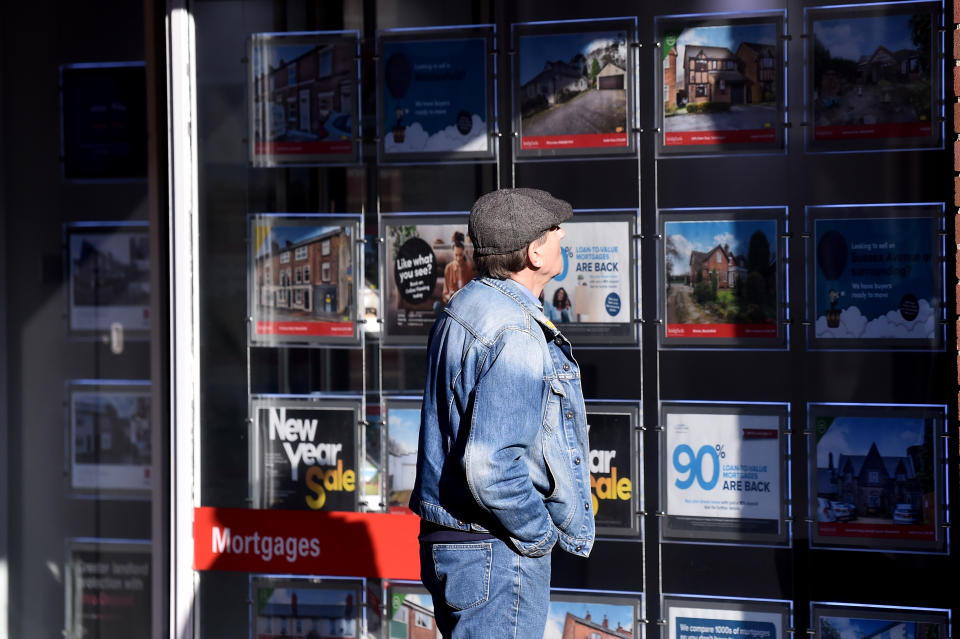 MACCLESFIELD-ENGLAND - FEBRUARY 01:  A man is seen looking at houses for sale at an estate agents on February 01, 2021 in Macclesfield , England . (Photo by Nathan Stirk/Getty Images)