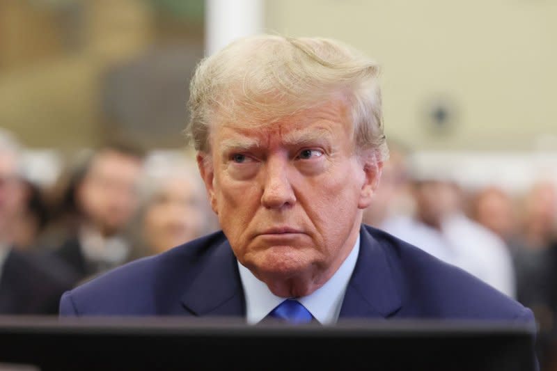 Former President Donald Trump appears in State Supreme Court in New York for the opening of his civil fraud trial on Monday. Photo by Brendan McDermid/UPI
