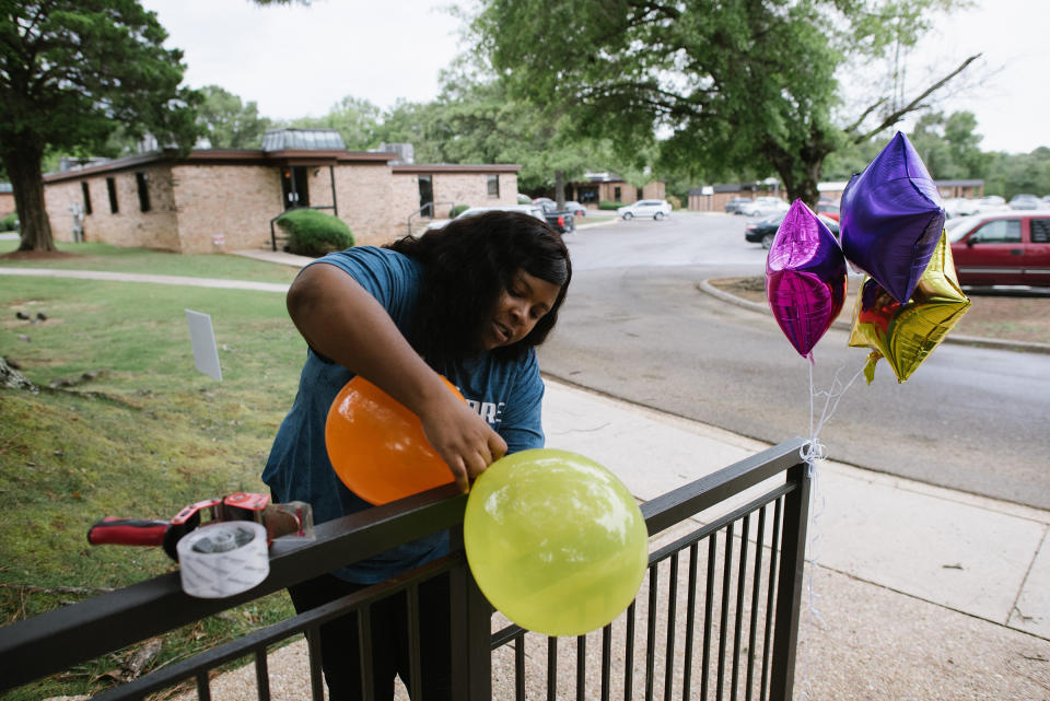 Medical assistant Jessica McKinstry ties balloons outside the clinic for the emergency-contraception fair on July 22.<span class="copyright">Lucy Garrett for TIME</span>