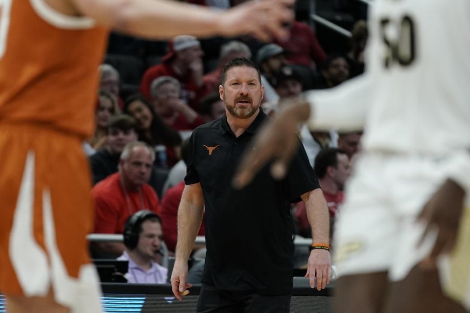 Texas head coach Chris Beard watches during the first half of a second-round NCAA college basketball tournament game against Purdue Sunday, March 20, 2022, in Milwaukee.