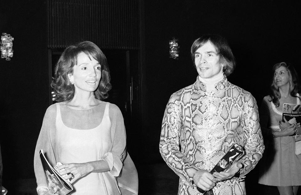 FILE - In this May 8, 1974 file photo, dancer Rudolf Nureyev, right, and Princess Lee Radziwill talk together during intermission at a performance of "Manon" by the Royal Ballet at the Metropolitan Opera House at Lincoln Center in New York. Radziwill, the stylish jet setter and socialite who made friends worldwide even as she bonded and competed with her older sister Jacqueline Kennedy, has died. She was 85. Anna Christina Radziwill told The New York Times her mother died Friday, Feb. 15, 2019, of what she described as natural causes. (AP Photo, File)