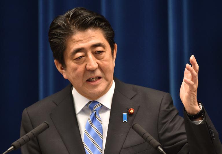 Japan's Prime Minister Shinzo Abe speaks during a press conference at his official residence in Tokyo, on November 18, 2014