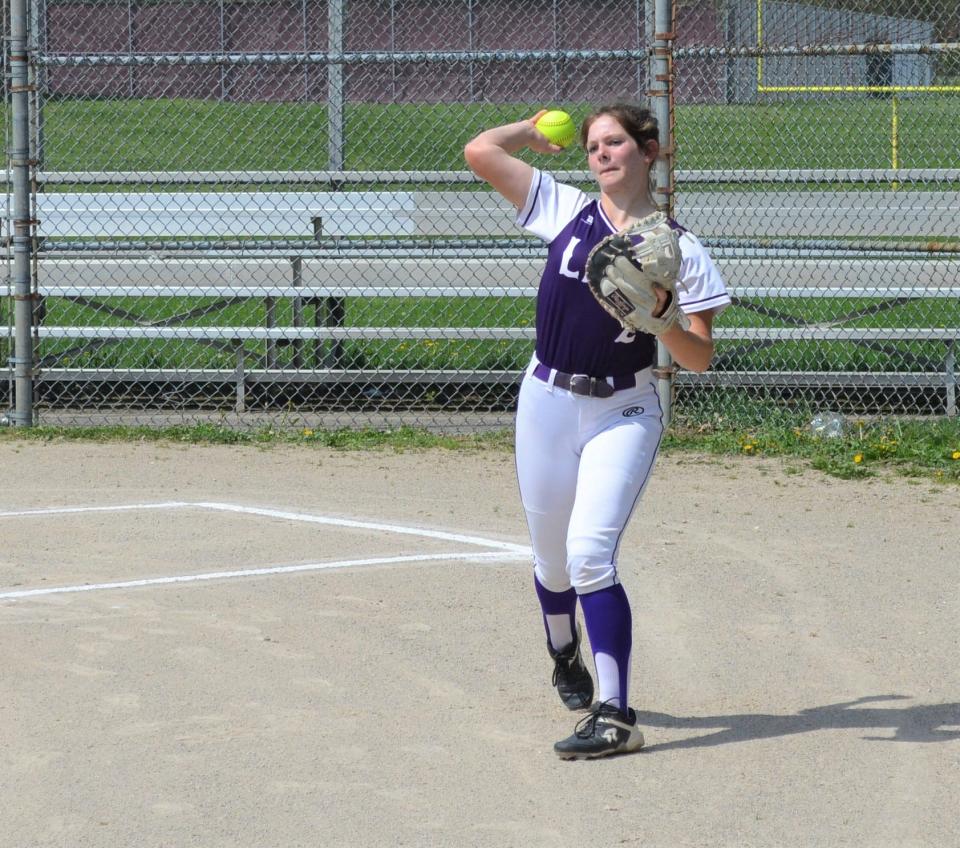 Lakeview catcher Paige Ratliff warms up before playing a game against Kalamazoo Central, which is coached by her brother Tyrus Ratliff.