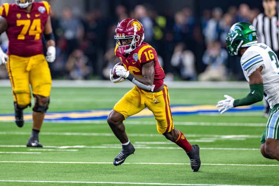 ARLINGTON, TX - JANUARY 02: USC Trojans wide receiver Tahj Washington (#16) runs up field during the Goodyear Cotton Bowl game between the USC Trojans and Tulane Green Wave on January 02, 2023 at AT&T Stadium in Arlington, TX.  (Photo by Matthew Visinsky/Icon Sportswire via Getty Images)