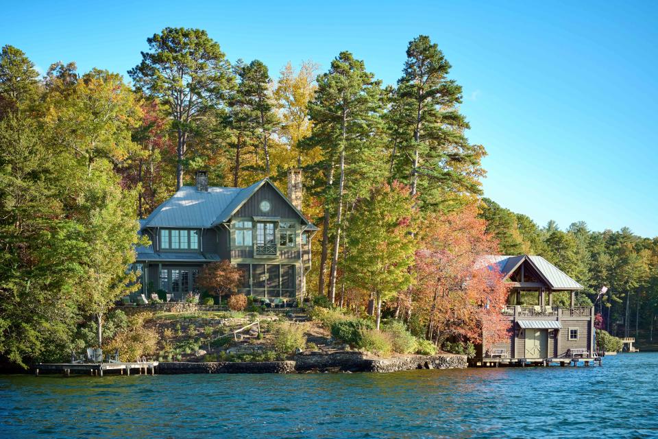 <p>Brian Woodcock</p> Every few weeks at 5 p.m., they host a boathouse party. A living-and-dining space on the upper level accommodates the crowd.