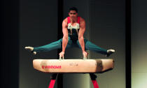 British gymnast Louis Smith athletes poses on a pommel horse in the newly unveiled British Olympic Team GB kit designed by Stella McCartney during a photocall in central London on March 22, 2012. AFP PHOTO / CARL COURT (Photo credit should read CARL COURT/AFP/Getty Images)