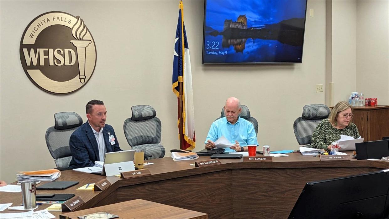 Dr. Donny Lee, Wichita Falls ISD superintendent, far left, and School Board trustees Mark Lukert, middle, and Sandy Camp prepare to return to open session for a School Board meeting at noon Tuesday, May 9, 2023.
