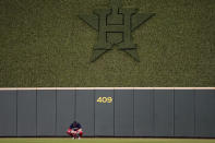 Boston Red Sox center fielder Enrique Hernandez waits in the outfield during the eighth inning in Game 6 of baseball's American League Championship Series Houston Astros Friday, Oct. 22, 2021, in Houston. (AP Photo/David J. Phillip)