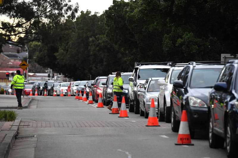 Long queues of cars are seen at a pop up Covid testing clinic at the Fairfield Showgrounds in Sydney.