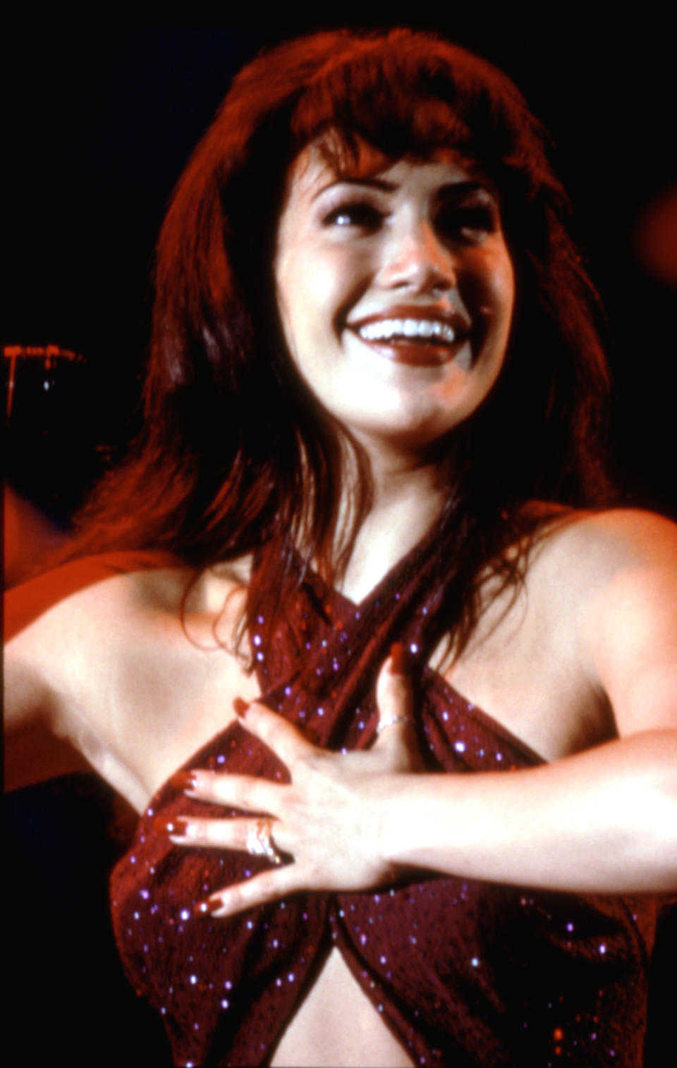 Selena performing in a jumpsuit in the film