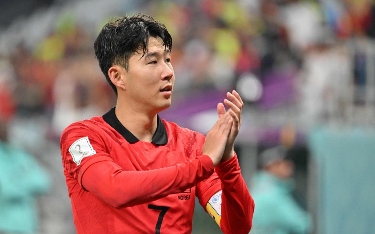 Son Heung-min celebrates at the end of the Qatar 2022 World Cup Group H football match between South Korea and Portugal at the Education City Stadium - South Korea World Cup 2022 results, squad list, fixtures and latest odds - AFP
