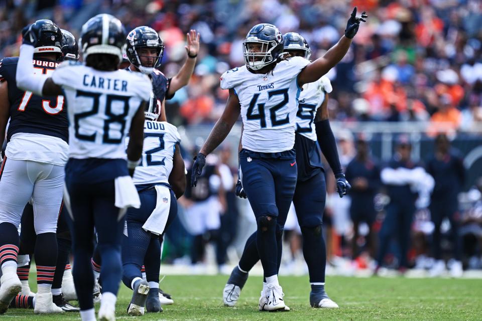 Aug 12, 2023; Chicago, Illinois, USA;  Tennessee Titans outside linebacker Caleb Murphy (42) celebrates after sacking the Chicago Bears quarterback in the second half at Soldier Field. Mandatory Credit: Jamie Sabau-USA TODAY Sports