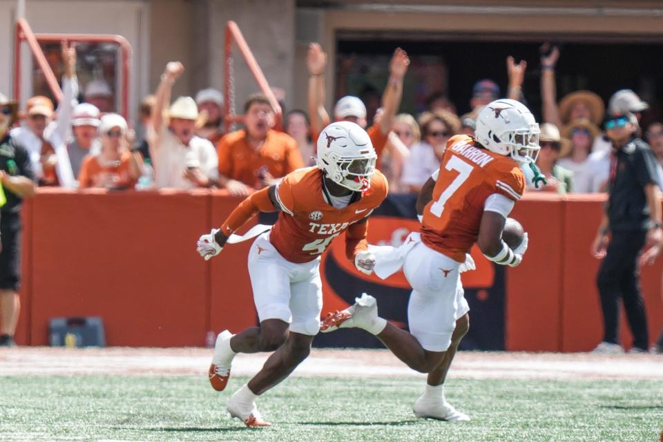 Jahdae Barron takes off upfield after making an interception against Colorado State on Saturday.