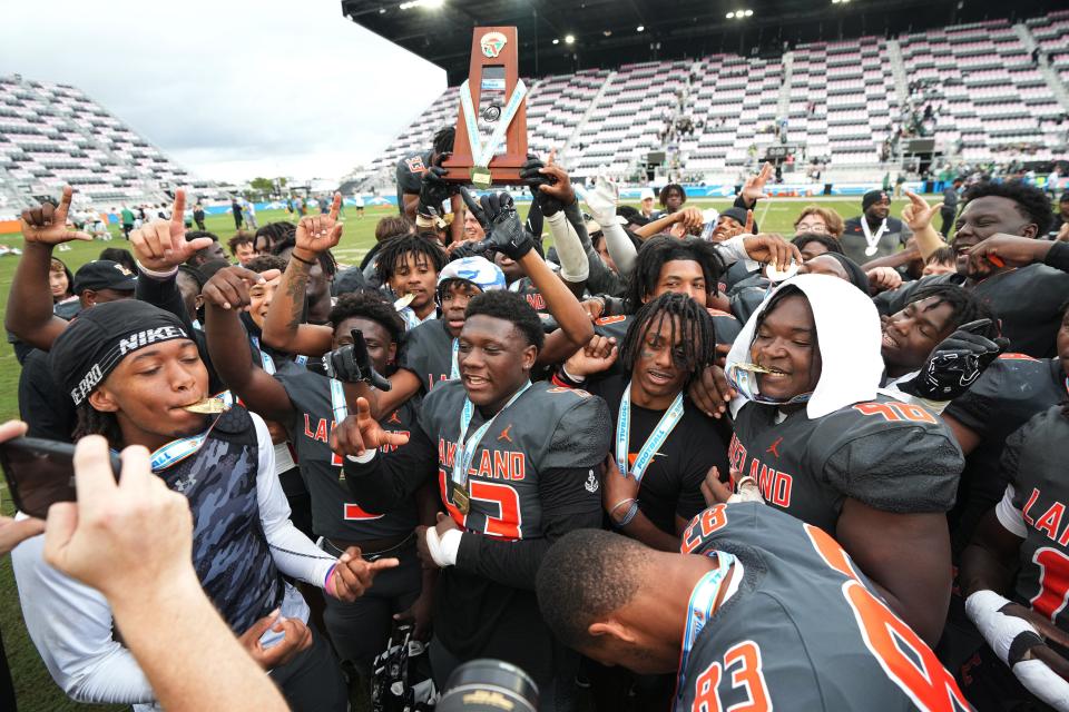 Lakeland celebrates winning the Class 4S state championship game over Venice 21-14 at DRV PNK Stadium, Saturday, Dec. 17, 2022 in Fort Lauderdale. 